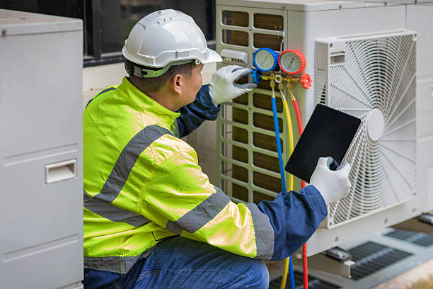 Professional Hvac technician working in Huletts Landing, NY